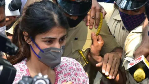 Getty Images Bollywood actress Rhea Chakraborty (C) arrives at the Narcotics Control Bureau (NCB) office for enquiry regarding Sushant Singh Rajput case, in Mumbai on September 6, 2020. 