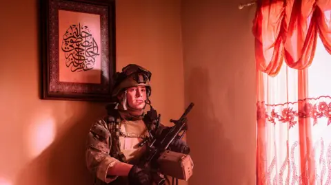 Murray Close Kit Connor in army uniform in an Iraqi house