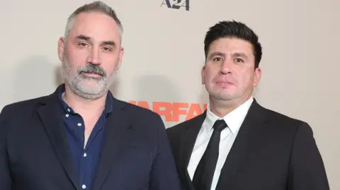 Getty Images Alex Garland and Ray Mendoza in suits at a film event