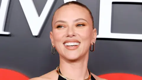 Getty Images Scarlett Johansson smiling on a red carpet