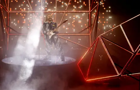 Reuters Sam Ryder plays guitar at the 2022 Eurovision Song Contest