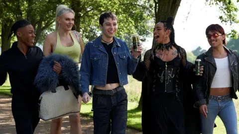 BBC/Hera/Enda Bowe The self-titled Fallen Divas - the group are pictured here walking in a park in clubwear, drinking alcohol and giggling.