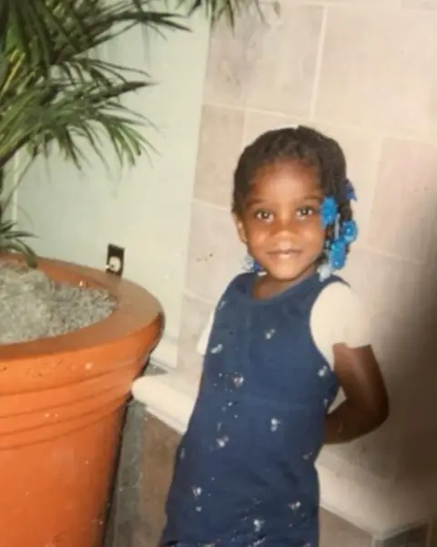 Doechii / X Doechii as a child