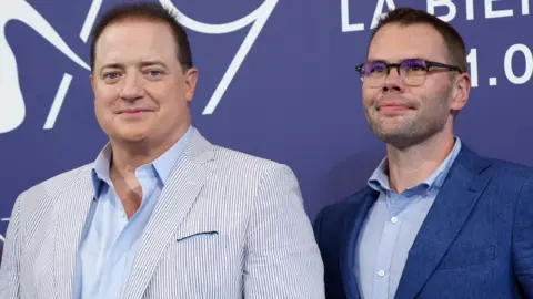 Getty Images Brendan Fraser and Samuel D. Hunter attend the photocall for "The Whale" at the 79th Venice International Film Festival on September 04, 2022 in Venice, Italy