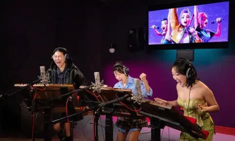 Ricky Midlesworth/ Netflix Ji-young Yoo (voice of ZOEY), Arden Cho (voice of RUMI) and May Hong (voice of MIRA)