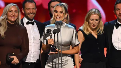 Getty Images Molly-Mae Hague accepts the 'Authored Doc' Award during the NTA's 2025 at The O2 Arena on September 10, 2025 in London, England. (Photo by Jeff Spicer/Getty Images for the NTA's) 
