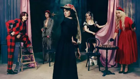 Laura Marie Cieplik The Last Dinner Party pose in a theatrical setting