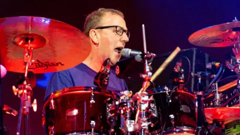 Getty Images/SOPA Images Dave Rowntree playing the drums
