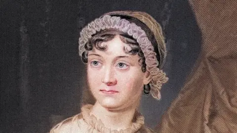 Getty Images A painting of Jane Austen, who has short curly hair, blue eyes and is wearing a pink ruffled headband.