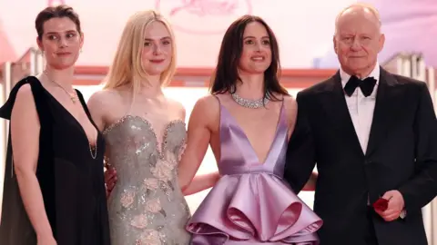 Getty Images Inga Ibsdotter Lilleaas, Elle Fanning, Renate Reinsve and Stellan Skarsgård attend the "Affeksjonsverdi" (Sentimental Value) red carpet at the 78th annual Cannes Film Festival at Palais des Festivals on May 21, 2025 in Cannes, France. 